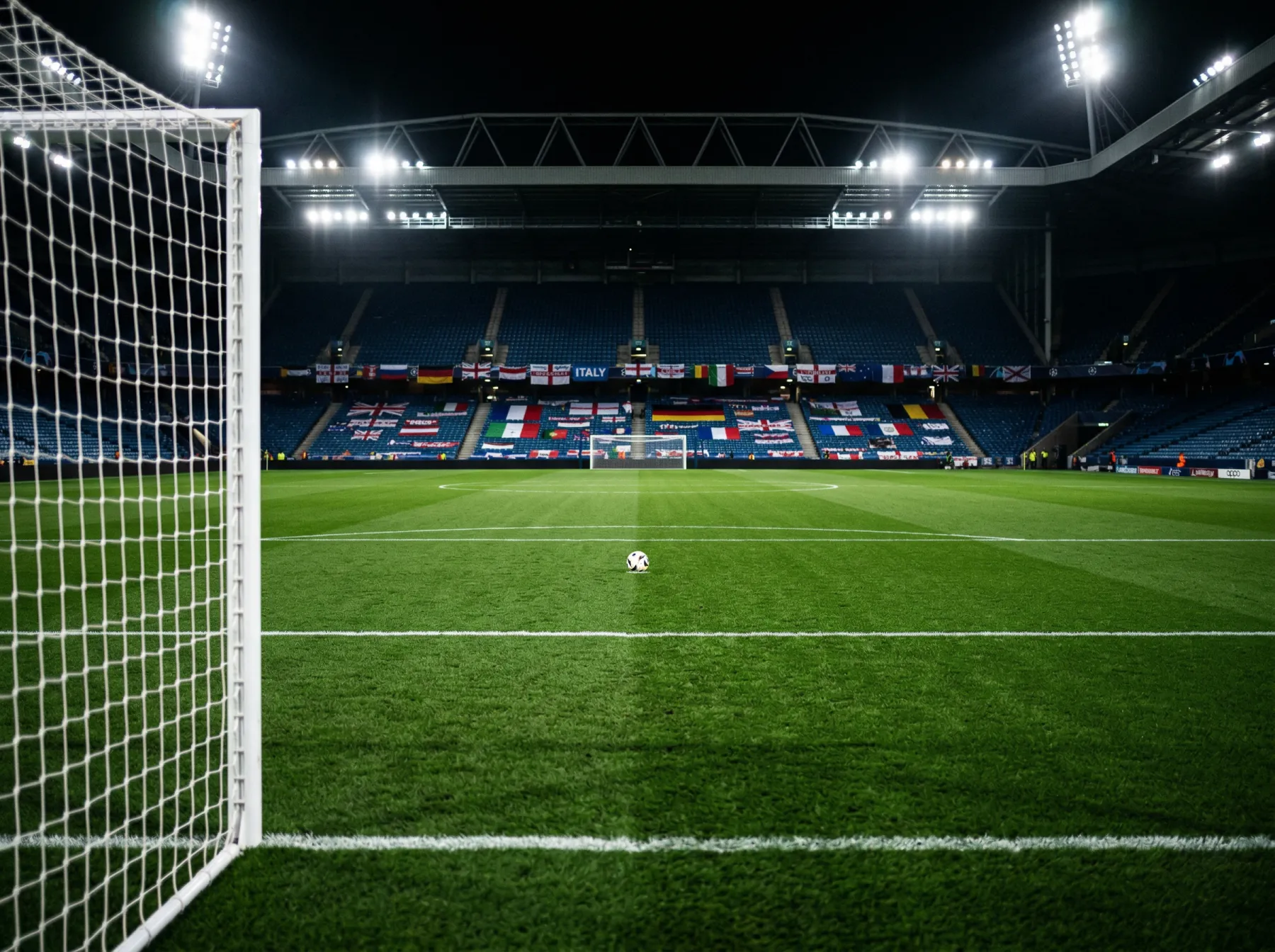 Football pitch marked with group formation lines during a World Cup group stage match under floodlights